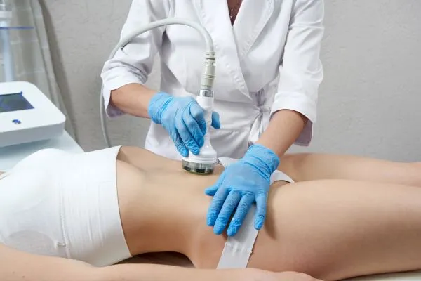 Lost the Weight but Not the Loose Skin? 2 woman having HIFU treatment on her stomach to combat loose skin Newark on Trent following weight loss